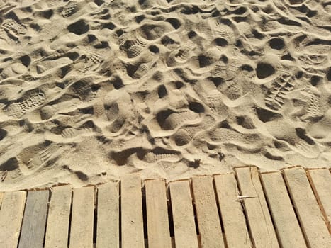 Wooden jetty on a sand beach
