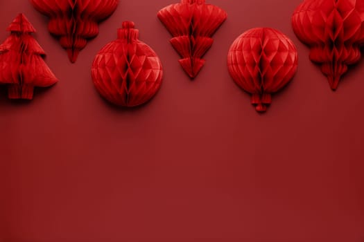Christmas or New Year background. Red burgundy color flat lay with decorations. Copy space area for advertising or marketing text. Paper balls and fit trees. Simple minimalistic greeting card mockup