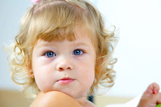 High key portrait of young blue eyed baby