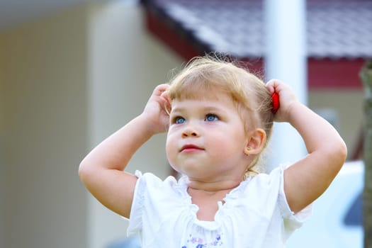 Outdoor  portrait of nice young blue eyed baby