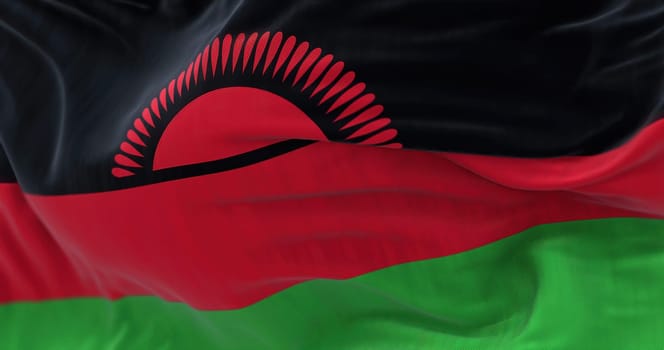 Close-up view of Malawi National flag waving. The Republic of Malawi is a landlocked country in Southeastern Africa. Fabric textured background. Selective focus. 3D illustration render
