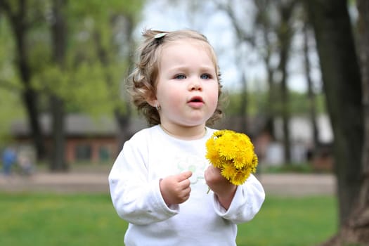 beautiful pretty girl with flower in the park