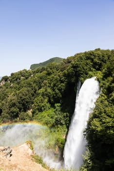 Marmore waterfall in Umbria region, Italy. Amazing cascade splashing into nature with trees and rocks.