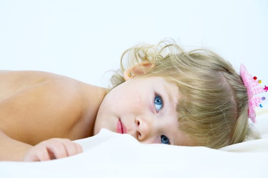 High key portrait of young blue eyed baby