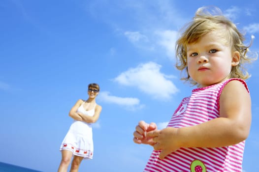view of young family hanging out in summer environment.
