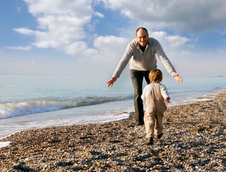 father and son on beach