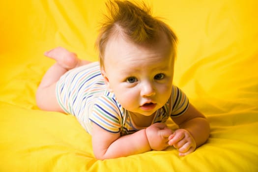 A portrait of a cute five month old baby boy. Shallow depth of field.