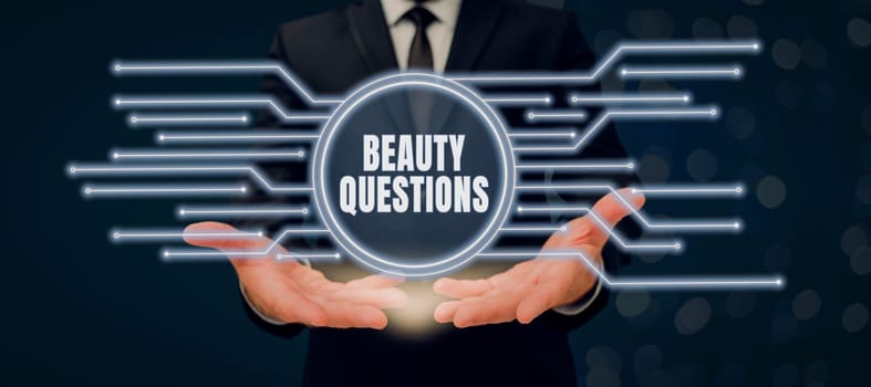 Hand writing sign Beauty Questions, Business approach digital marketplace where traders can buy and sell bitcoins Businessman Holding Futuristic Design Over Hands And Showing New Data.