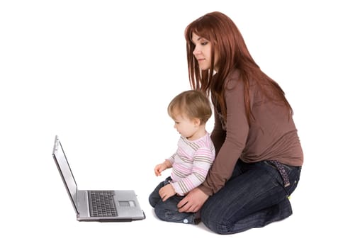 mother and daughter playing on laptop