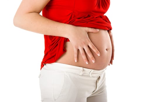Beautiful pregnant woman showing her big tummy