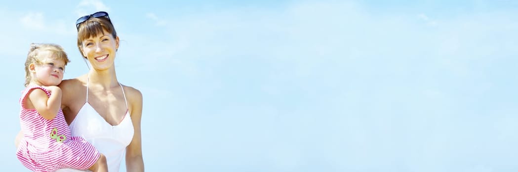 portrait of young happy mother holding her  baby . banner, lots of copy space