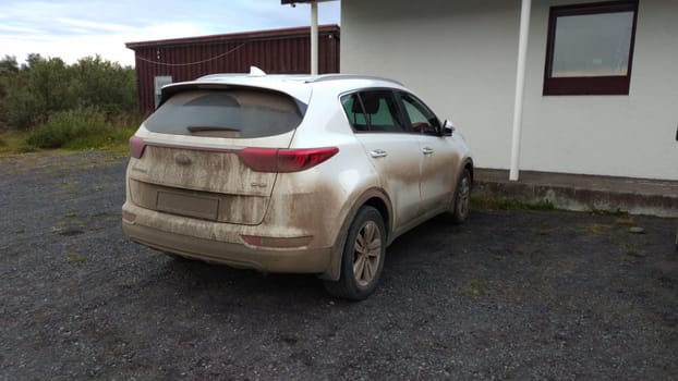 A dirty KIA SUV car after off-road ride in Iceland