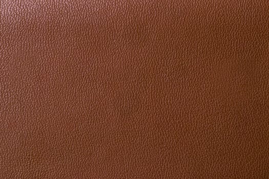 Leather background texture. Closeup of genuine brown leather detail for design work. High resolution image or macro.