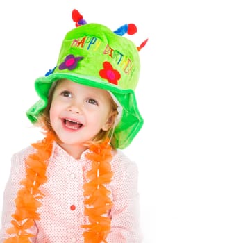cute little girl with green hat celebrating her birthday