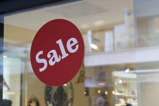 Sticker with the word Sale on the window of a store in Berlin
