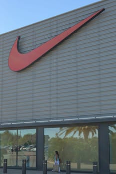 mallorca, balearic islands spain-november 05 2022: woman shopping in Mallorca Fashion Outlet, shopping center sports store nike