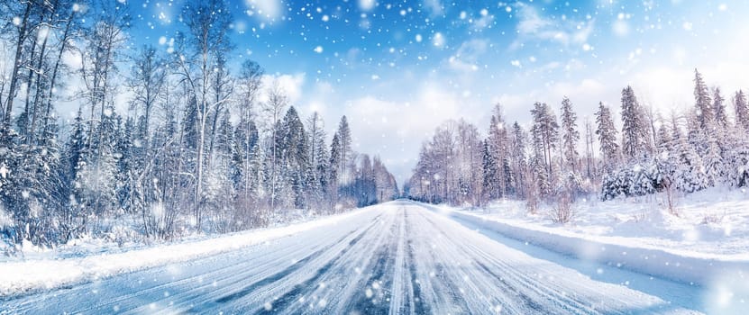 Beautiful view of the empty country snowy road. Scenery landscape.