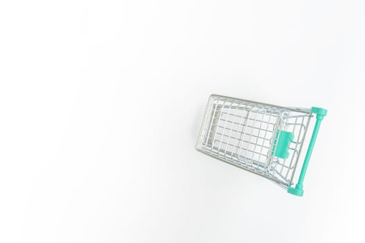 Empty shopping trolley on white background. Copy space.