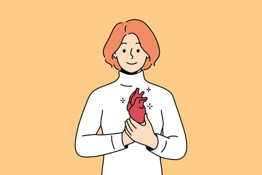 Smiling young man holding heart in hands. Happy female demonstrate healthy heart. Cardiovascular problem and healthcare. Vector illustration.