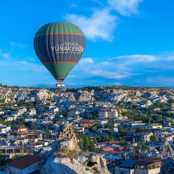 GOREME/TURKEY - June 27, 2022:  hot air balloons fly over the town