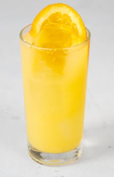Freddy Fudpucker cocktail garnished with orange wheel