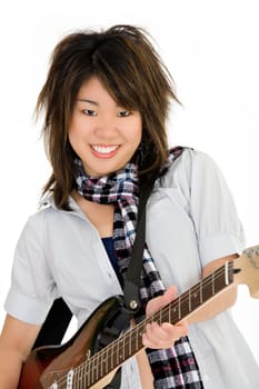Caucasian teenager posing as a punk rocker on white background