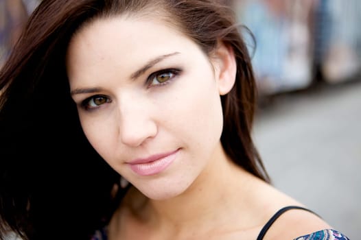 Beautiful Brunette with an edge and darker eye makeupA Sexy Brunette Looking Toward The Camera with an edgy look