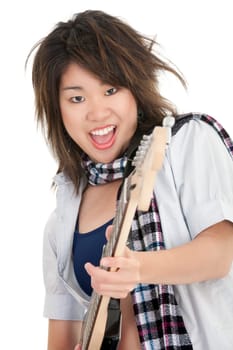 Caucasian teenager posing as a punk rocker on white background