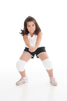 Cute Caucasian girl hitting the ball in volleyball