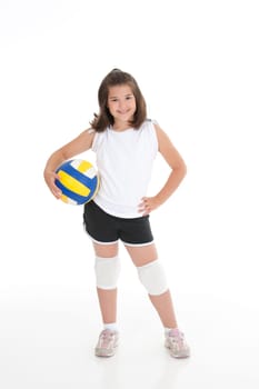 Portrait of a cute eight year old girl in volleyball outfit