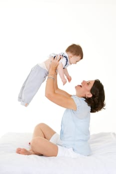 Beautiful Caucasian mother and baby boy  bonding