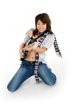 Caucasian teenager posing as a punk rocker on white background