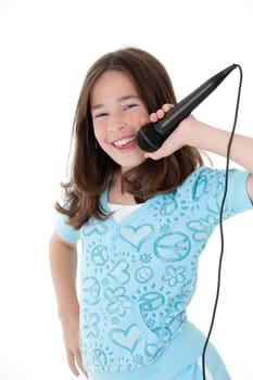 Caucasian children singing karaoke on a white background