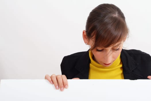 smiling woman with a blank bulletin board over white
