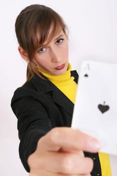 unhappy woman showing a playing card at the camera