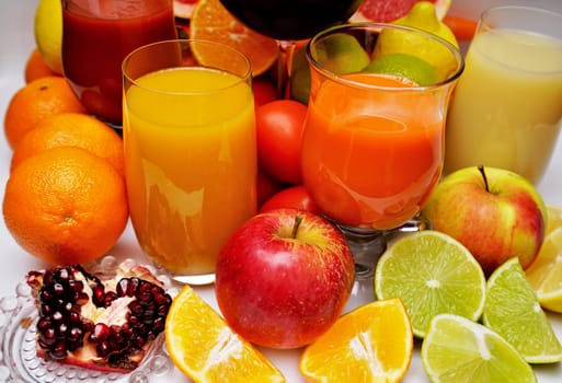 Healthy fruit and vegetable juices on a white background