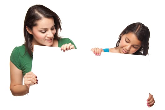 Pretty Hispanic Girl and Mother Holding Blank Board Isolated on a White Background.