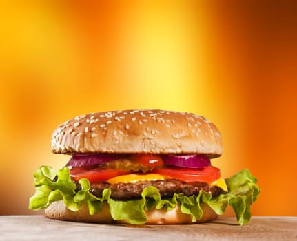 Cheeseburger with onions tomato and ketchup