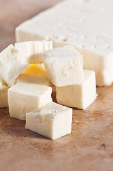 Cubed feta cheese on a kitchen counter
