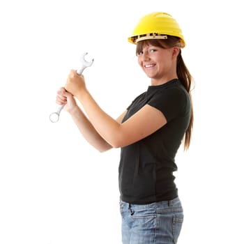 Young woman builder at work with big french key, isolated on white
