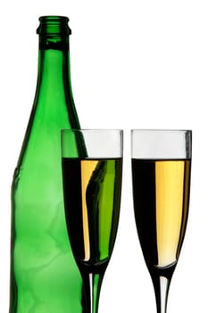 Two champagne glasses and a bottle in silhouette