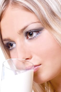 beautiful woman drinking milk on a white background