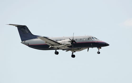 Turboprop airplane in flight side view