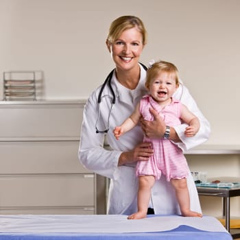 Doctor and baby girl in doctor’s office