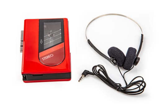 Red Walkman with Headphone and Tape isolated on bright background