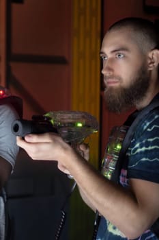 laser tag game player shooting toy gun science fiction vest in amusement center