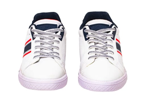 White sneakers isolated. Close-up of a pair white elegant stylish leather sport shoes isolated on a white background. Clipping path. Kids shoe fashion. Modern design footwear for workout. Macro.