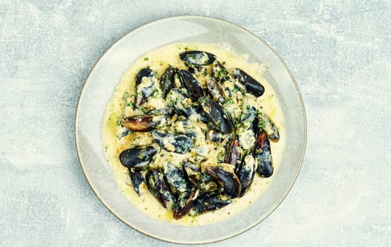 Cooked appetizing mussels in a creamy sauce