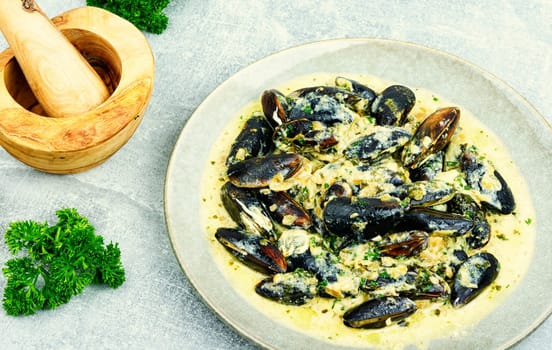 Cooked appetizing mussels in a creamy sauce