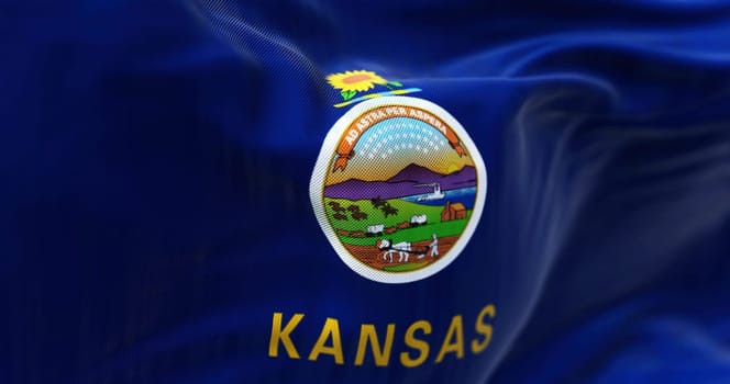 Close-up view of Kansas state flag waving in the wind. Kansas is a state in the Midwestern United States. Fabric textured background. Selective focus. 3D illustration